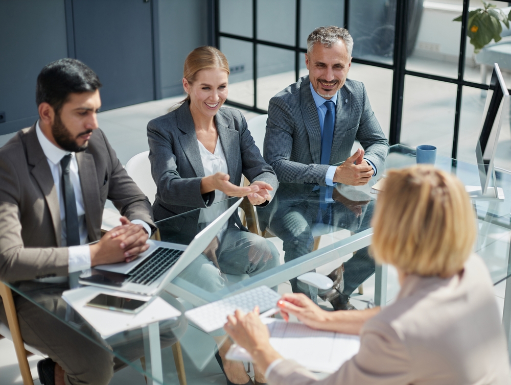 A,Group,Of,Colleagues,Reached,An,Agreement,In,The,Negotiations