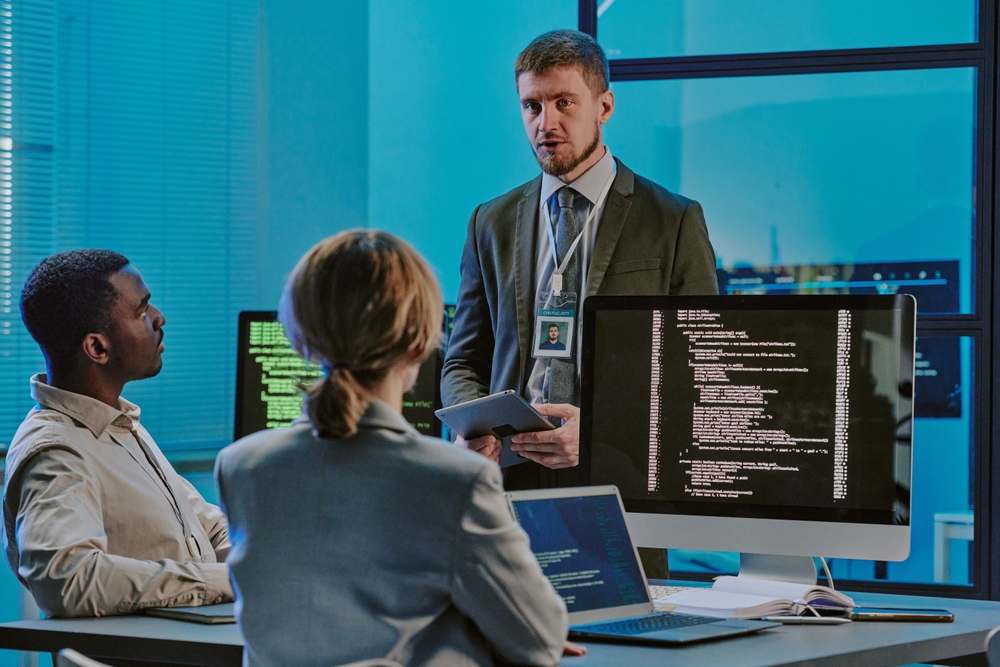 Group,Of,Three,Diverse,Young,People,Discussing,Issues,During,Meeting