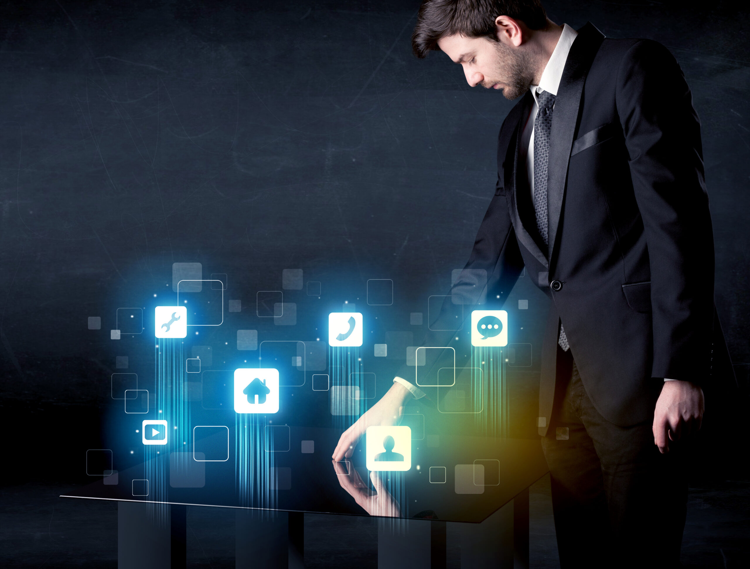 man in suit interacting with virtual touchscreen